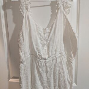 Maurice's white tank